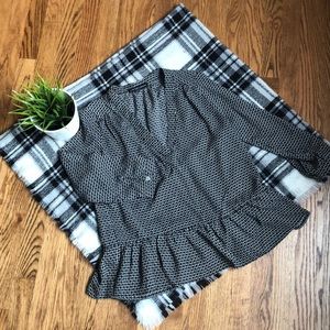 Black and white ruffle hem top. Size small.